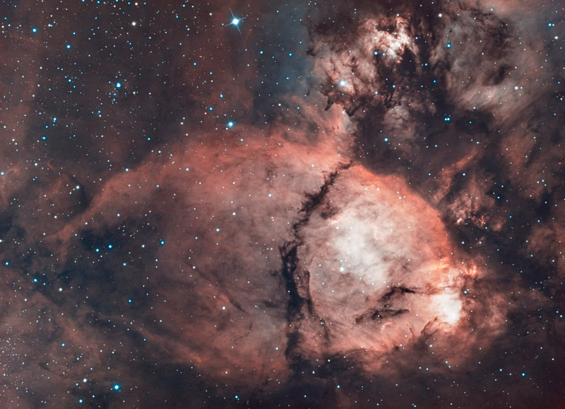To some, this nebula looks like the head of a fish. However, this colorful cosmic portrait really features glowing gas and obscuring dust clouds in IC 1795, a star forming region in the northern constellation Cassiopeia. The nebula's colors were created by adopting the Hubble false-color palette for mapping narrow emission from oxygen, hydrogen, and sulfur atoms to blue, green and red colors, and further blending the data with images of the region recorded through broadband filters. Not far on the sky from the famous Double Star Cluster in Perseus, IC 1795 is itself located next to IC 1805, the Heart Nebula, as part of a complex of star forming regions that lie at the edge of a large molecular cloud. Located just over 6,000 light-years away, the larger star forming complex sprawls along the Perseus spiral arm of our Milky Way Galaxy. At that distance, this picture would span about 70 light-years across IC 1795.